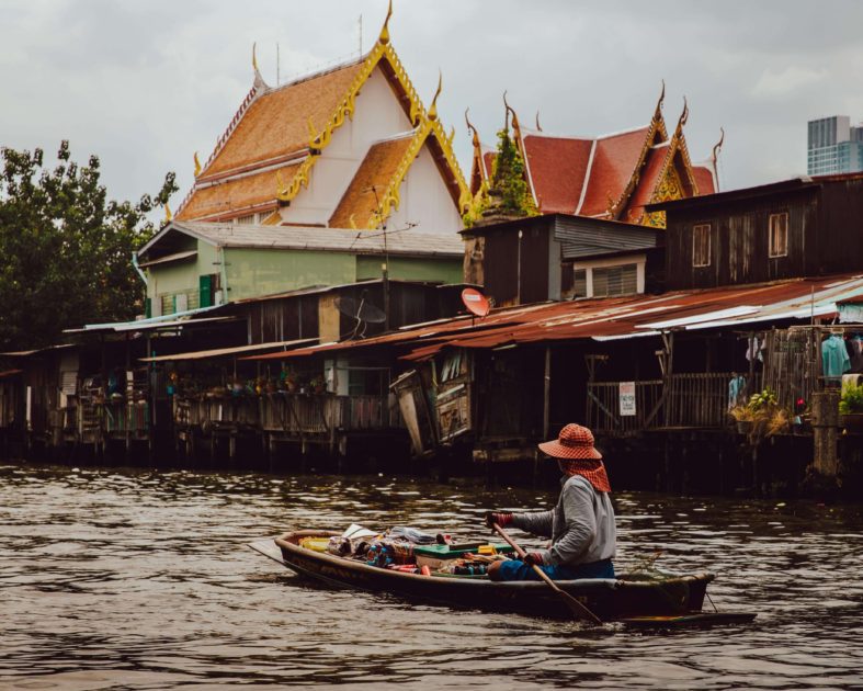 Woman in boat on a body of water in Thailand