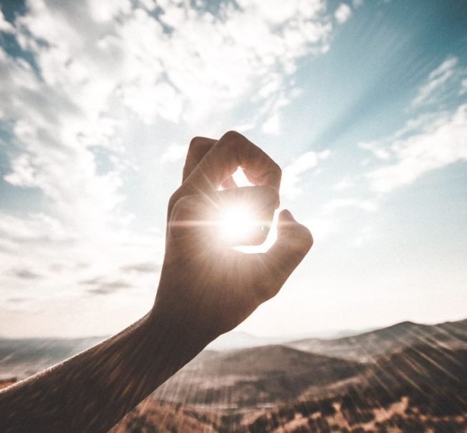 Sun shining through hand