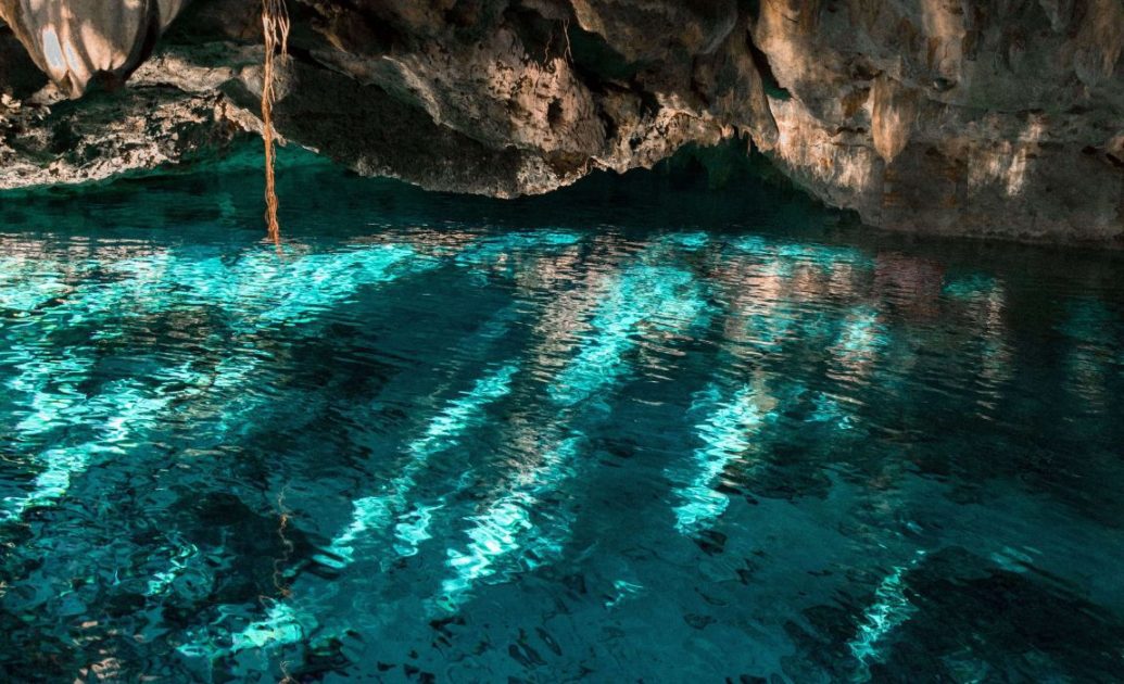 Cave Cenote filled with clear blue water